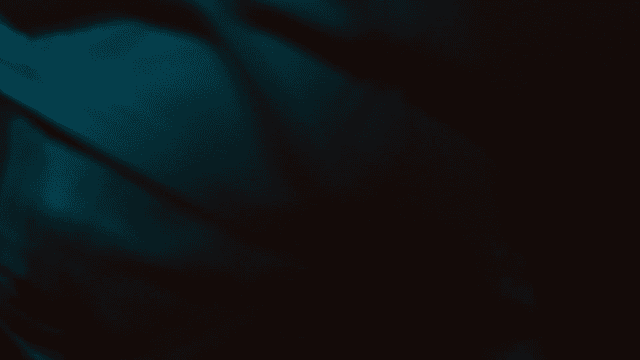 Person stretching with cup of mixed coffee on table