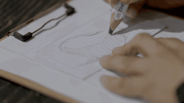 Person who sketches designs on paper