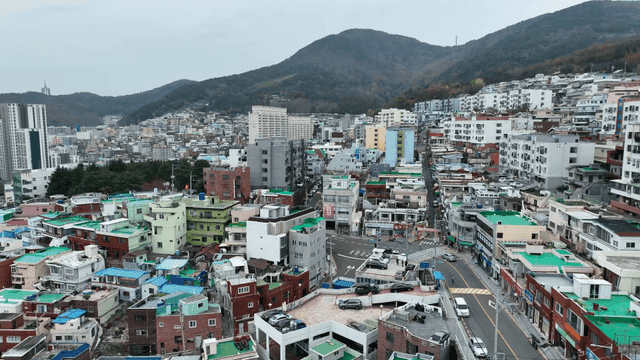 Colorful urban landscape with mountains