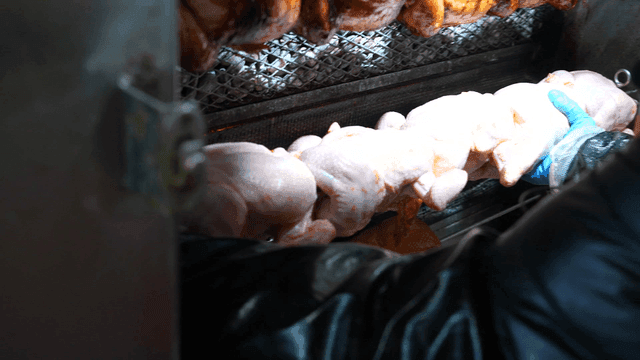 Person who skewers rotisserie chicken