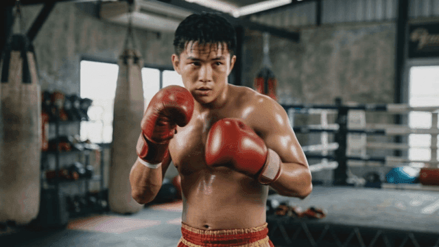Boxer training in a gym with focus