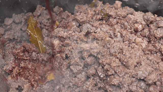 Wine poured over minced beef cooked with bay leaves