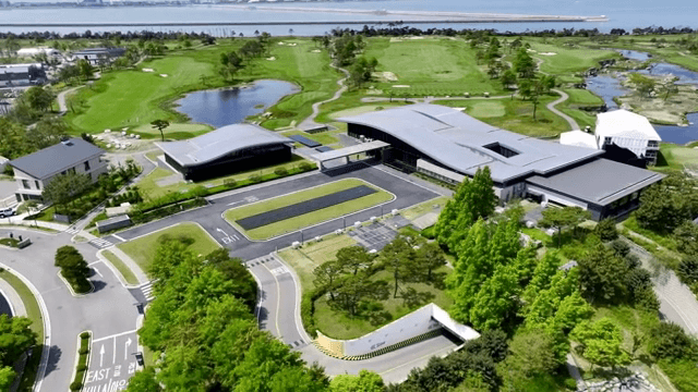 Modern golf course with clubhouse and greenery