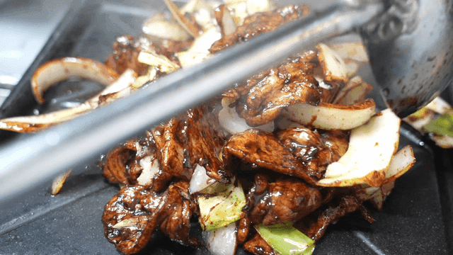 Soy sauce stir-fried pork served on hot plate