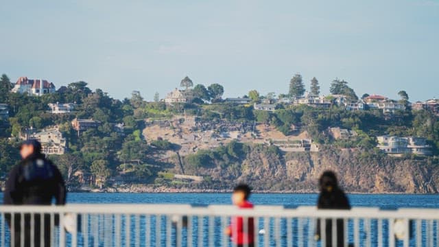 Coastal View with People at Pier Railing