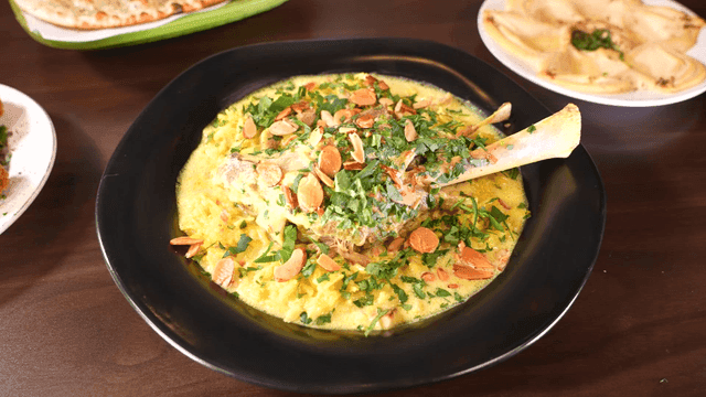 Lamb Mansaf topped with various spices served on plate