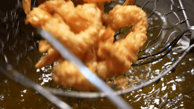 Fried shrimp taken out of hot oil