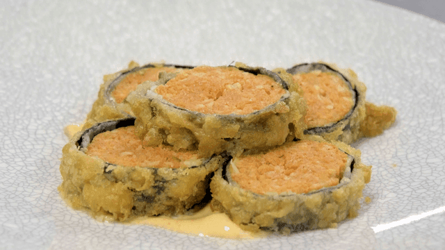 Crispy fried sushi rolls on plate
