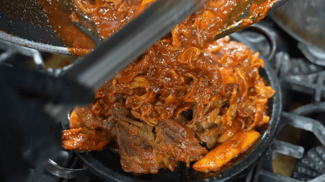 Spicy crunchy braised pork ribs cooked on hot plate