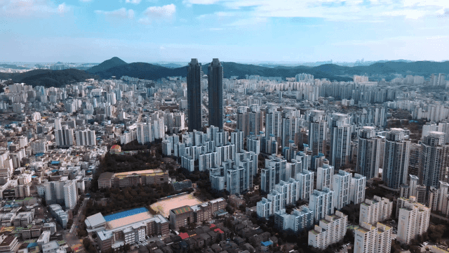 Vast cityscape with high-rise buildings under clear sky