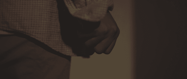 Hand clutching bills