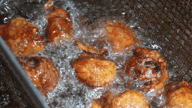 Chicken skin dumplings fried in hot oil