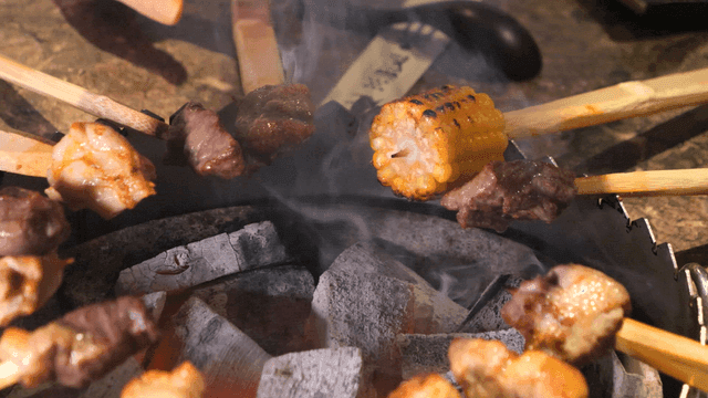 Grilling over charcoal primitive skewers