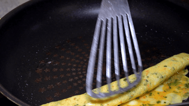 Rolled omelet cooking in pan