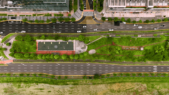 Aerial view of a city with roads and greenery