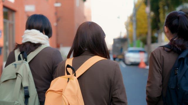 Students walking on the street in winter