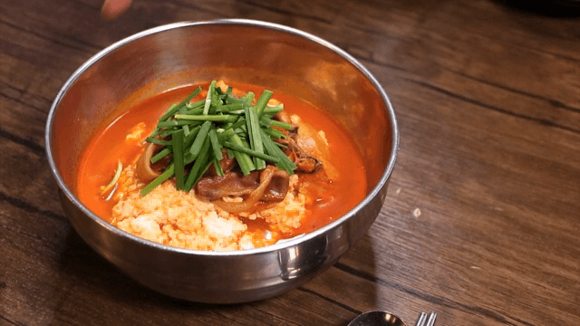 Spicy seafood soup with soft bean curd on the table