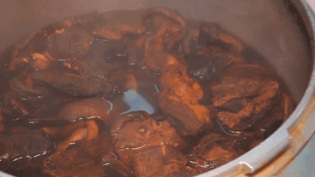 Mushrooms simmering in a pot