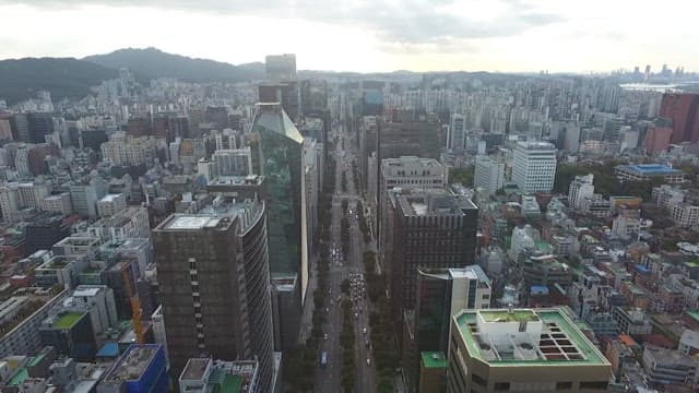 Busy roads and tall city buildings at noon
