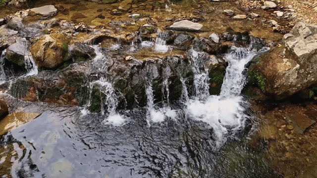 Small waterfall flowing over rocks