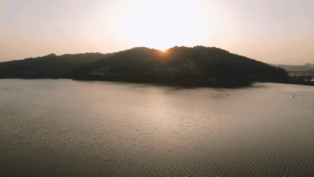 Sunset over a tranquil lake and hills