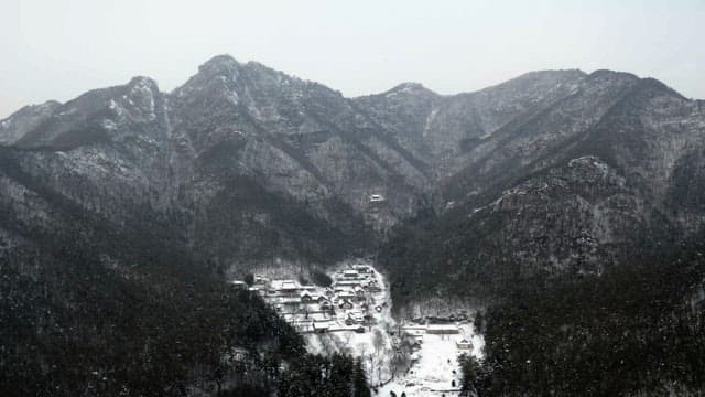 Temple located in the middle of a snow-covered mountain