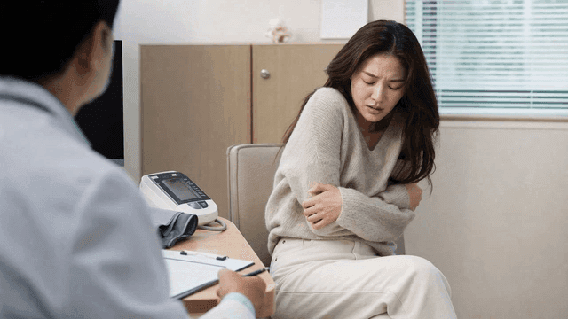 Female patient feeling cold and consulting doctor