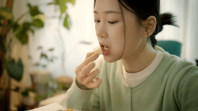 Woman eating chicken radish at home