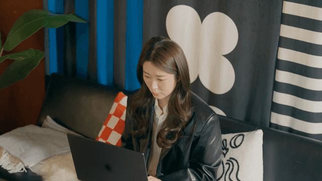 Woman working on a laptop indoors