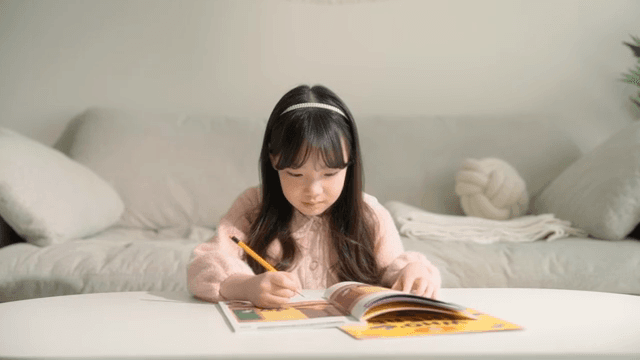 Young girl focused on her homework