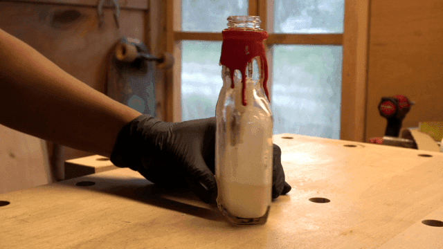 Candle inside a glass bottle