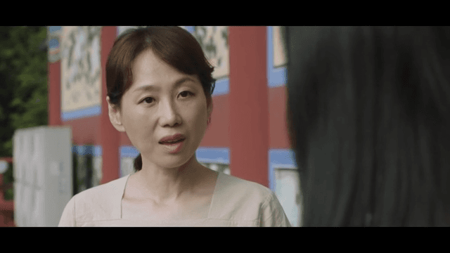 Woman talking with an annoyed expression