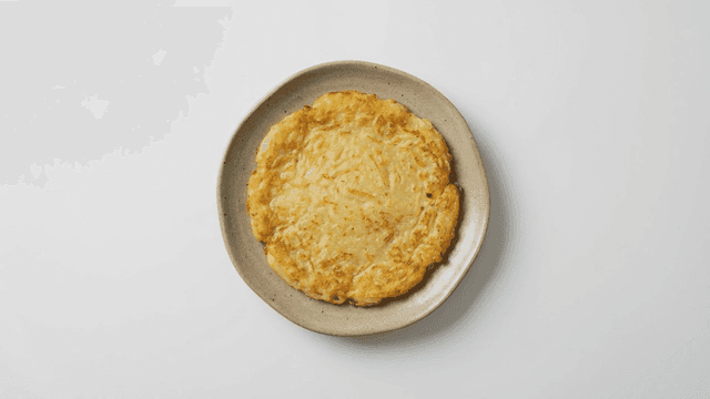 Golden brown potato pancakes on plate