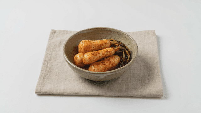 Bowl containing young radish kimchi
