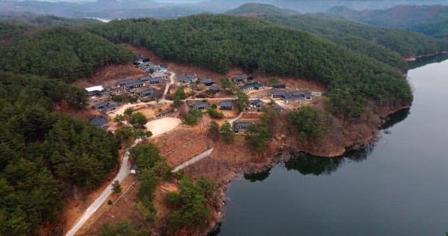 Aerial View of Traditional Village by the Lake