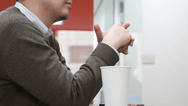 Man sitting at table talking