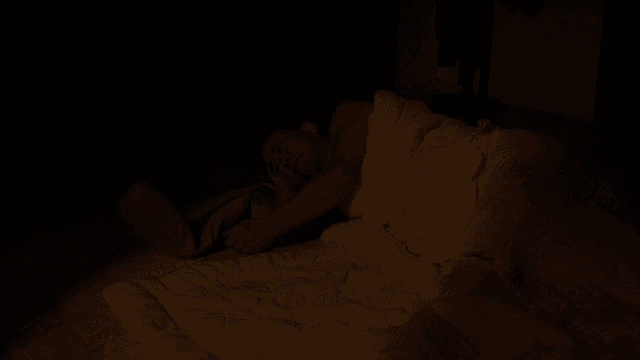 Man lying down and leaving dark room