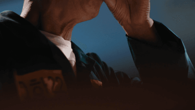 Elderly prisoner drinking water from cup