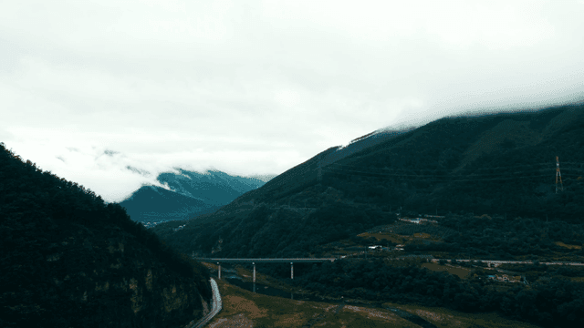 Misty mountains with a winding road