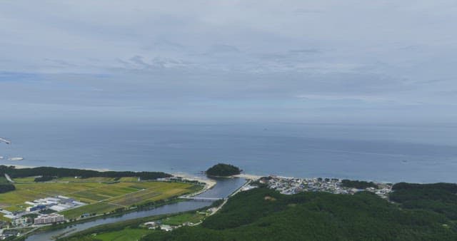 Coastal village with mountains and ocean