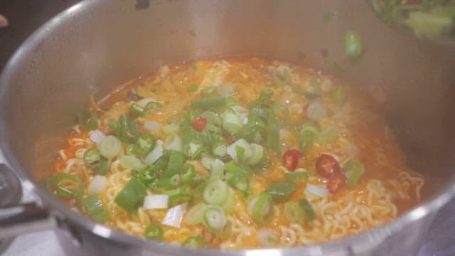 Spicy ramen with green onions and chili peppers