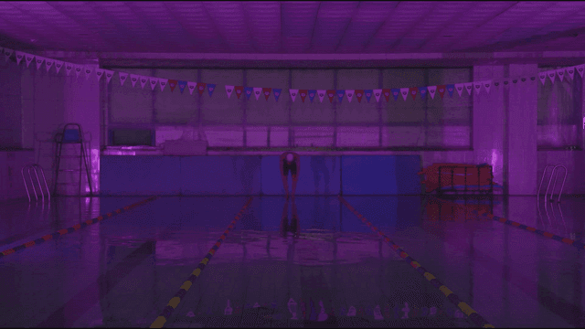 A swimmer preparing to dive in a pool