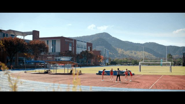 Students stretching on a school track field