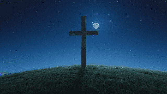 Cross on a hill under a starry night sky