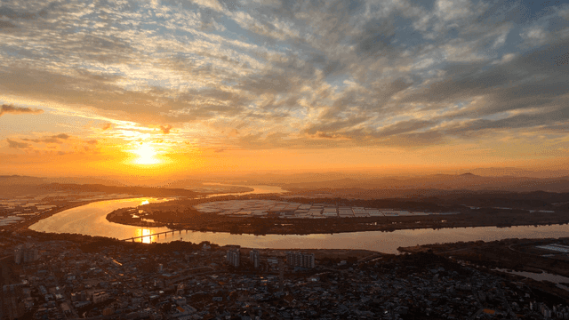 Cityscape with river at sunset