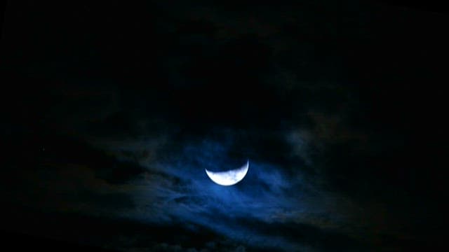 Moonlit Night Sky Over Ocean Horizon