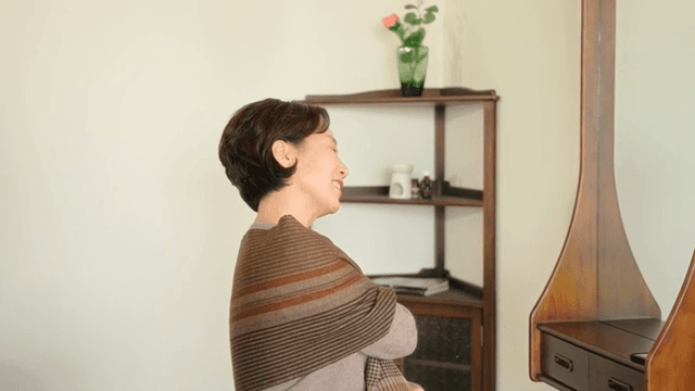 Woman smiling while talking on the phone
