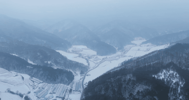 Snow-covered mountains and valleys