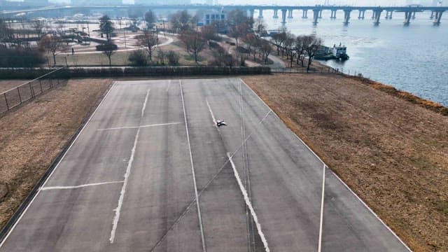 Person Trying to Control a Drone at Han River Park