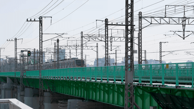 Tram crossing city bridge
